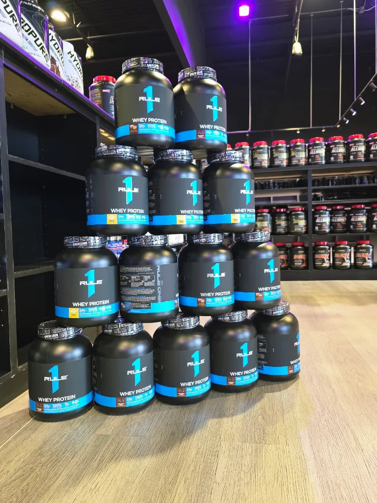 Rule 1 whey protein display photographed inside the SuppVerse store